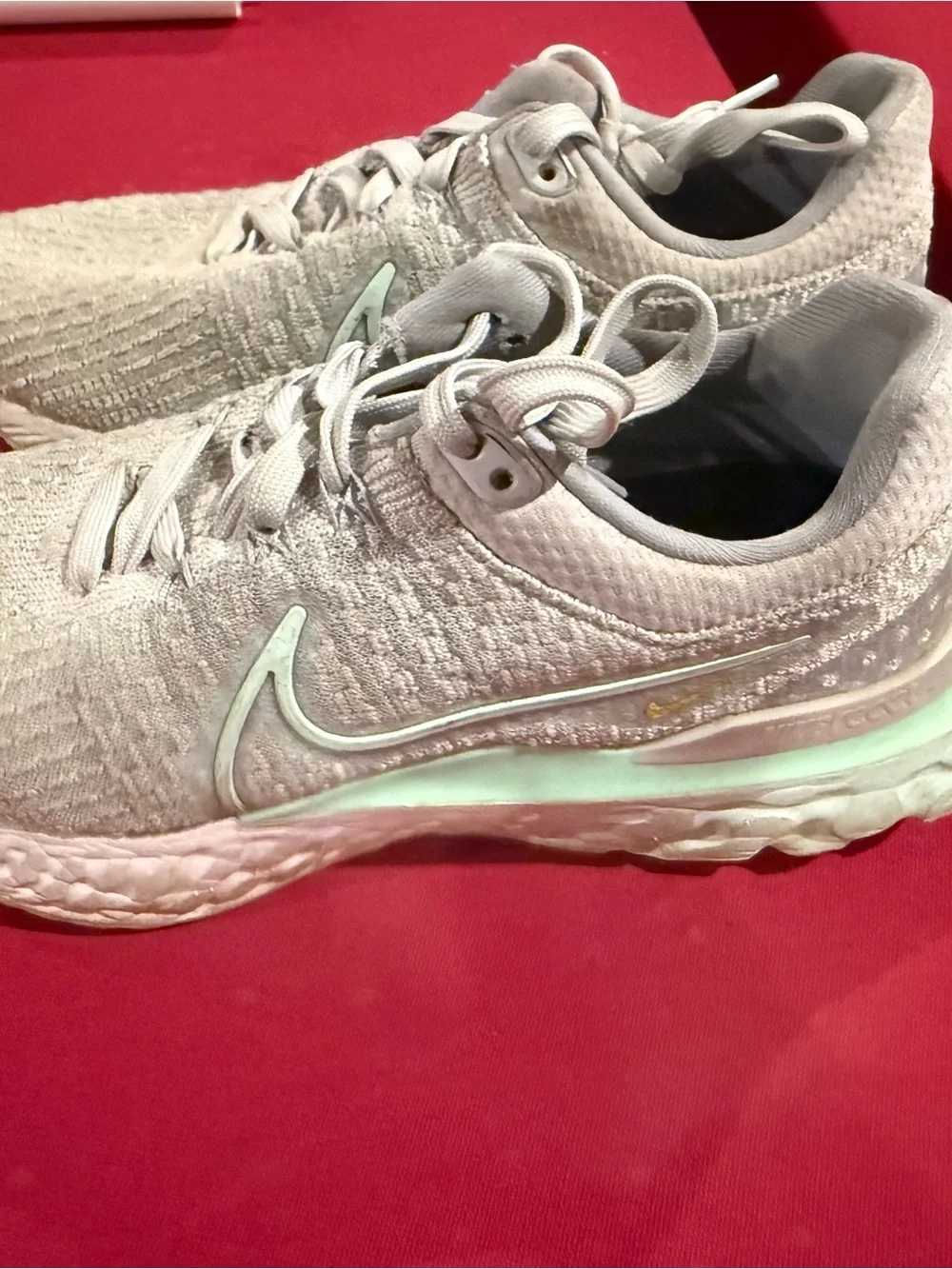 Nike Women’s Light Gray Knit Sneakers with Mint Accents